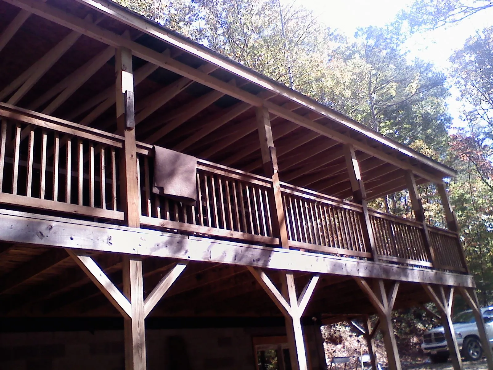 Timber framing under a new elevated porch and deck — Roof Leak Repair in Ohio City by Roofing Brothers