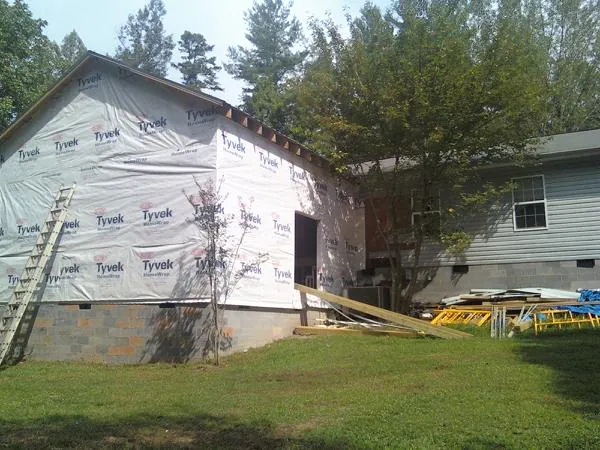 Tyvek wrapped gable on a new room addition beside an existing home in Ohio City